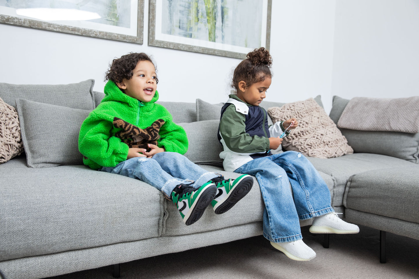 little boy wearing Air Jordan 1 High Kids 'Lucky Green' on foot