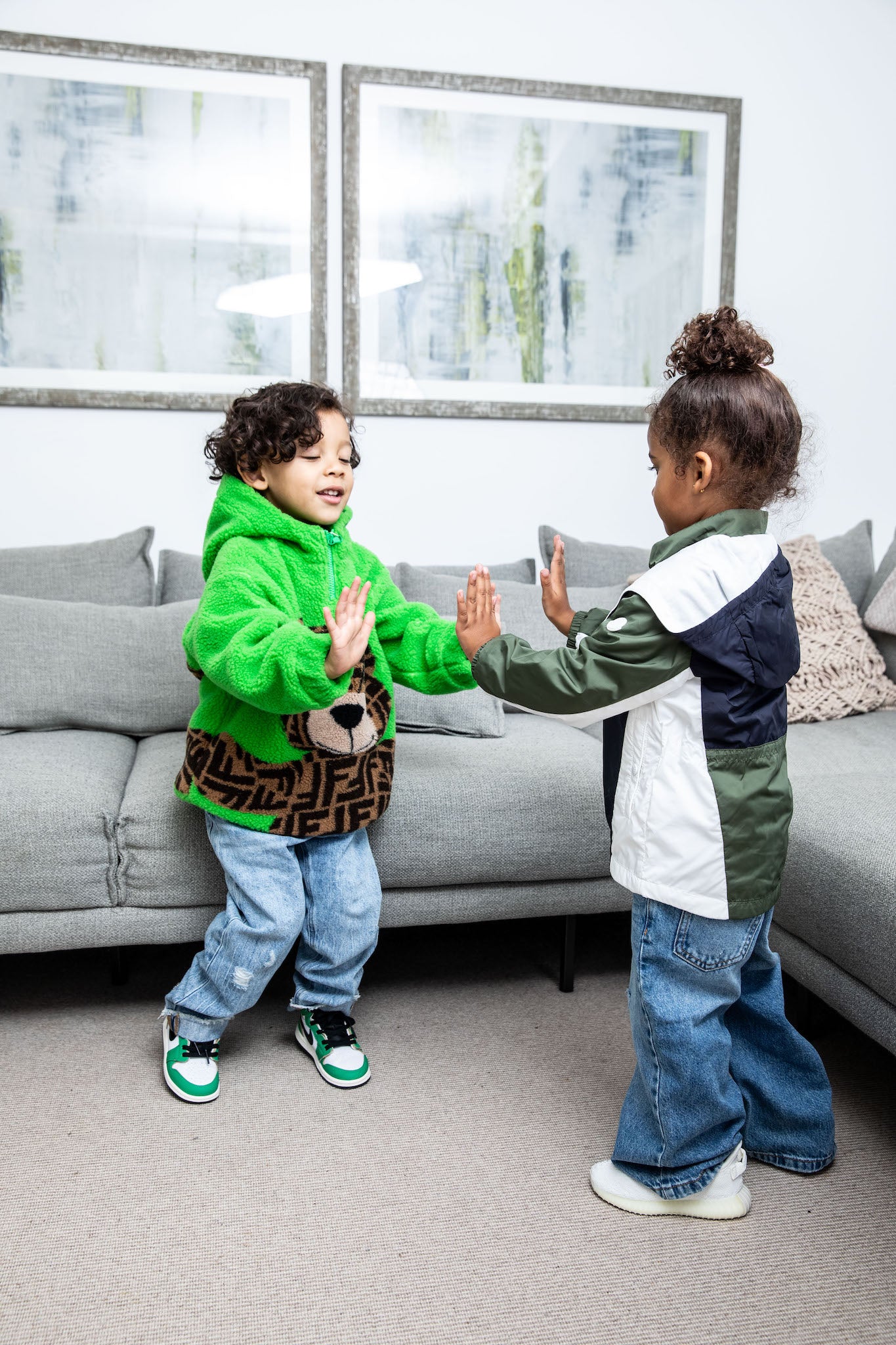 little boy wearing Air Jordan 1 High Kids 'Lucky Green' on foot