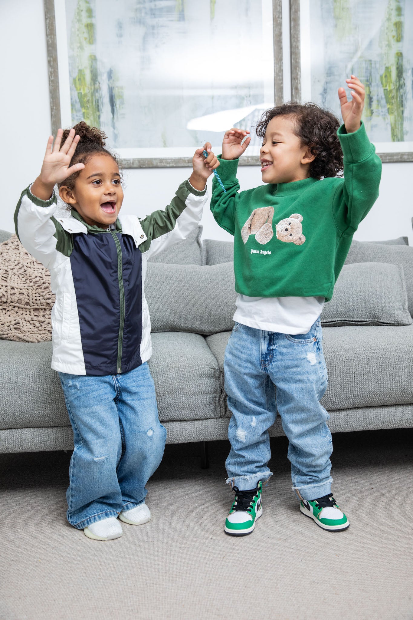 little boy wearing Air Jordan 1 High Kids 'Lucky Green' on foot