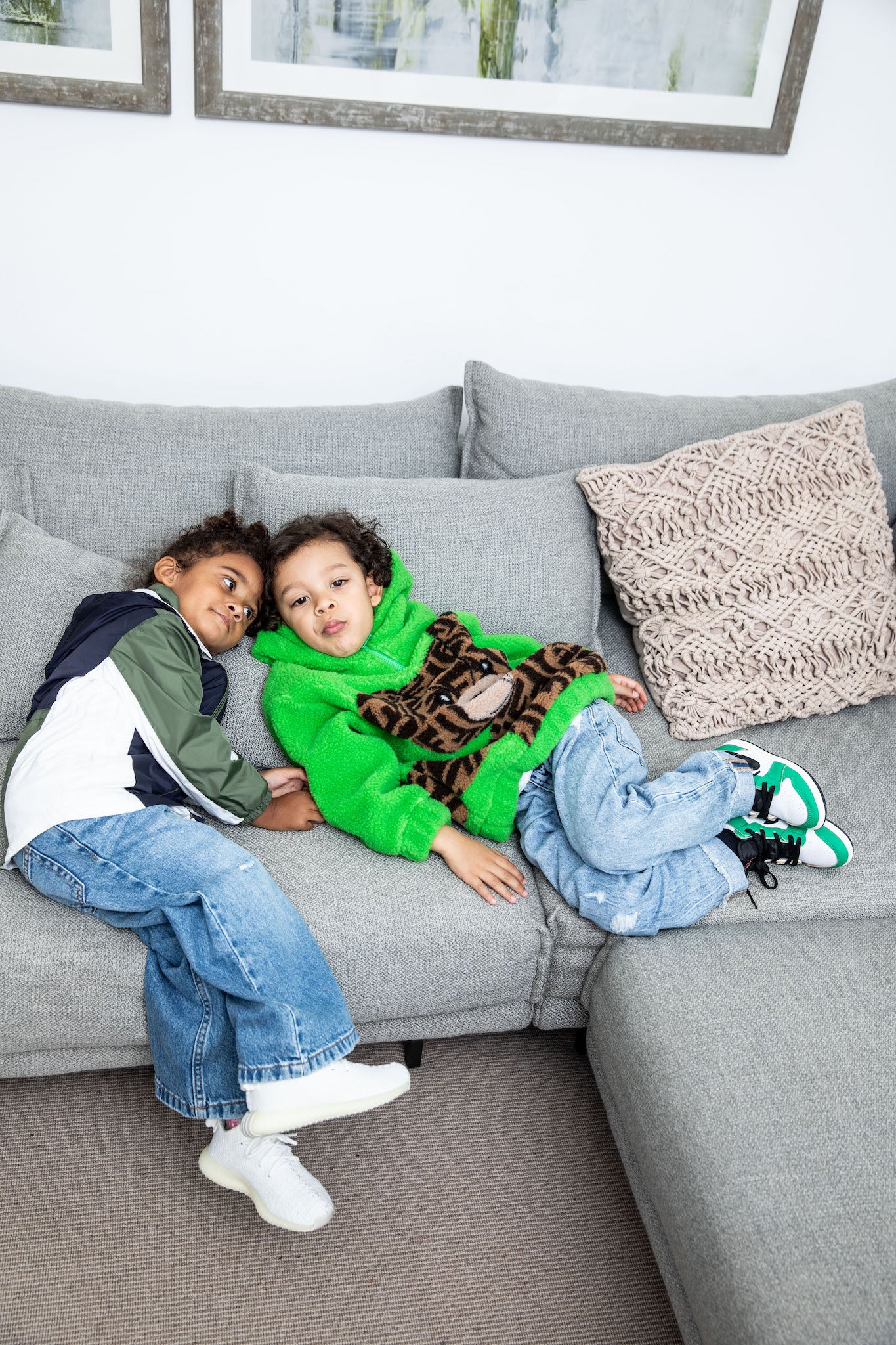 little boy wearing Air Jordan 1 High Kids 'Lucky Green' on foot