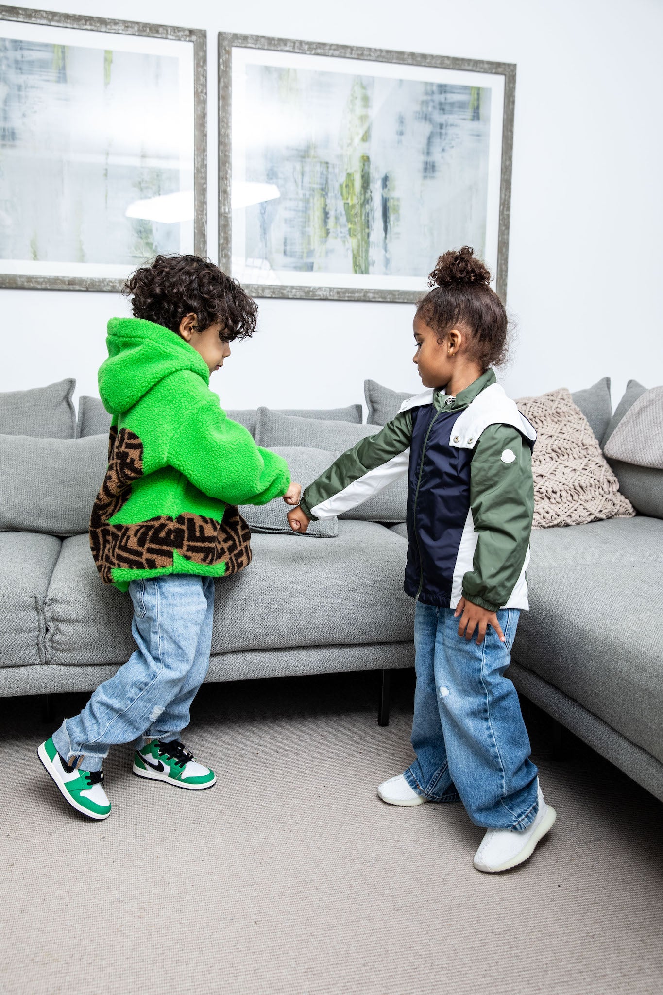 little boy wearing Air Jordan 1 High Kids 'Lucky Green' on foot