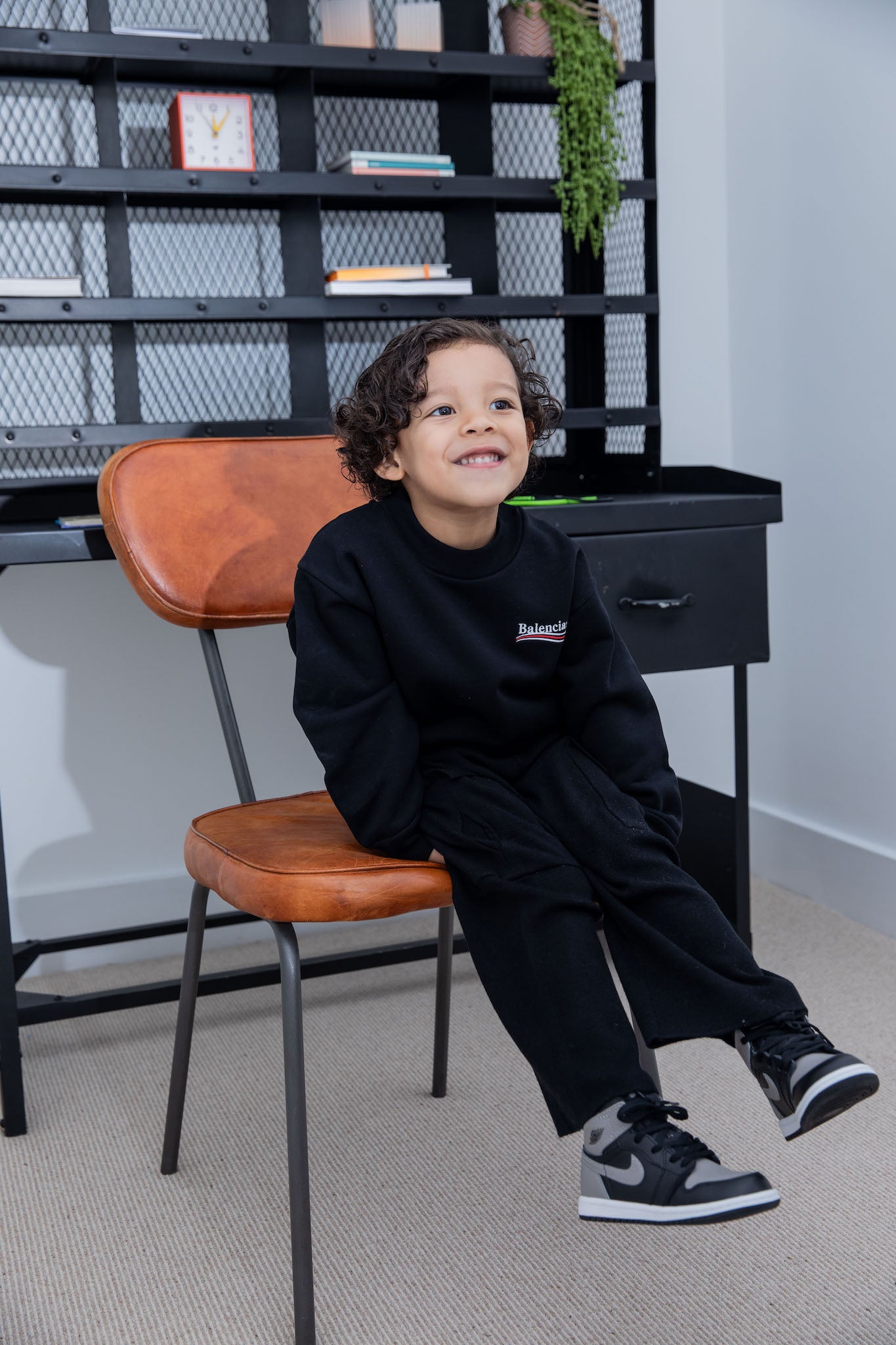 little boy wearing air jordan 1 high kids shadow on foot