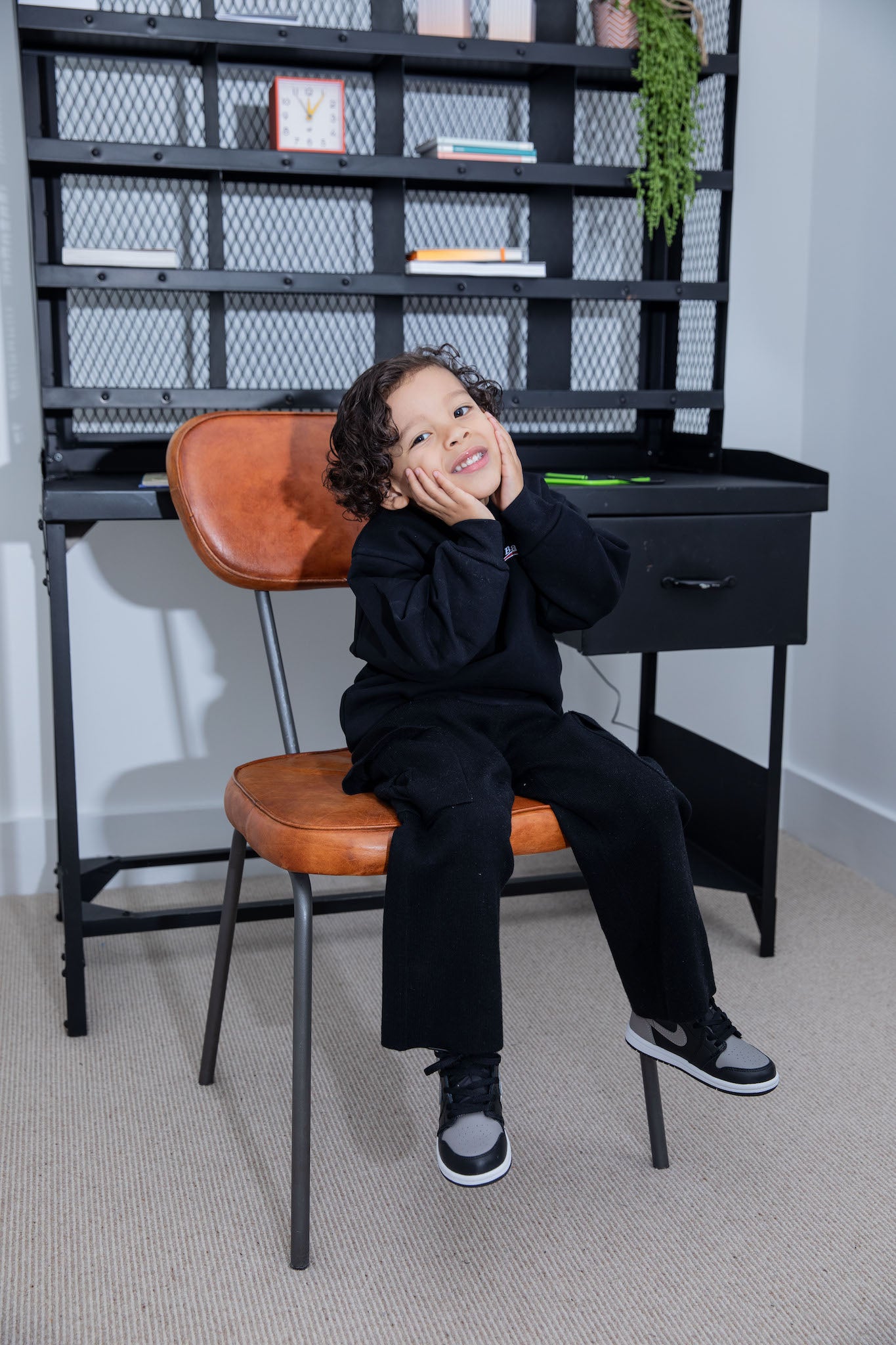 little boy wearing air jordan 1 high kids shadow on foot