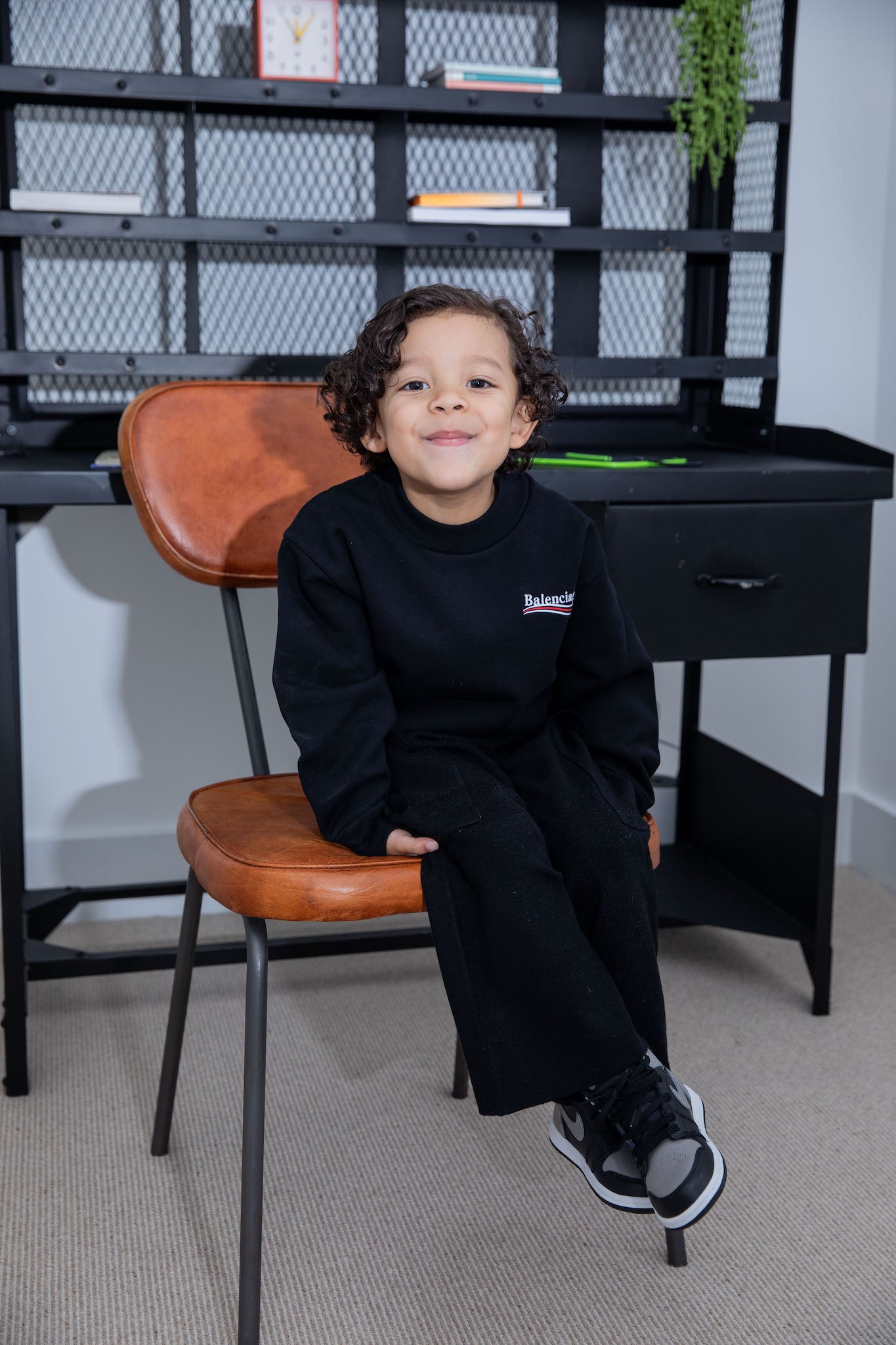 little boy wearing air jordan 1 high kids shadow on foot