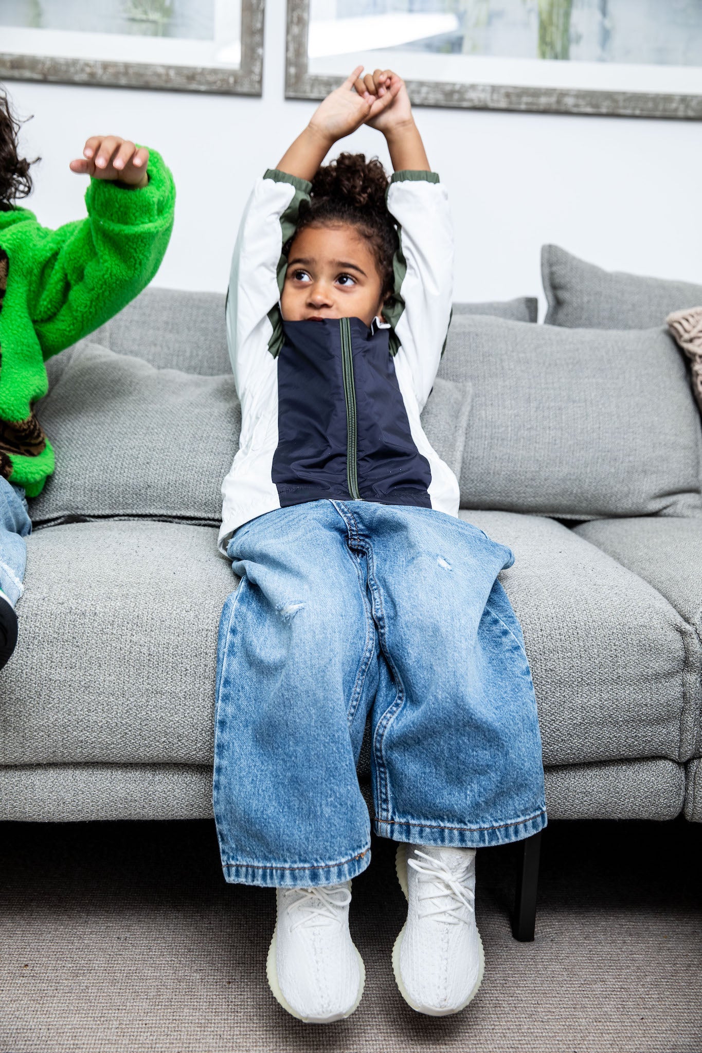little girl wearing Adidas Yeezy Boost 350 V2 Kids 'Cream' on foot