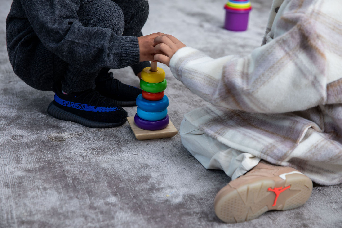 girl wearing adidas Yeezy Boost 350 V2 Kids 'Dazzling Blue' on foot\