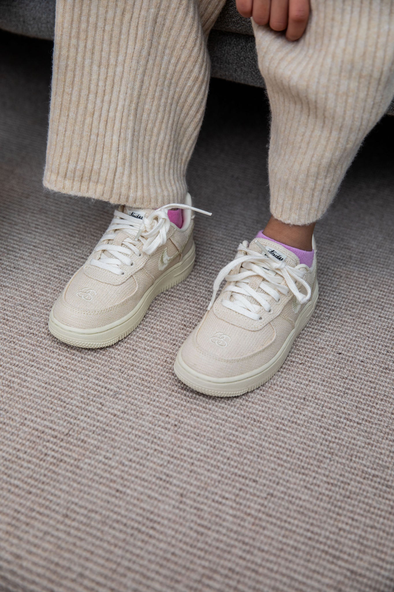 girl wearing Nike Air Force 1 Low Kids x Stussy 'Fossil' on foot