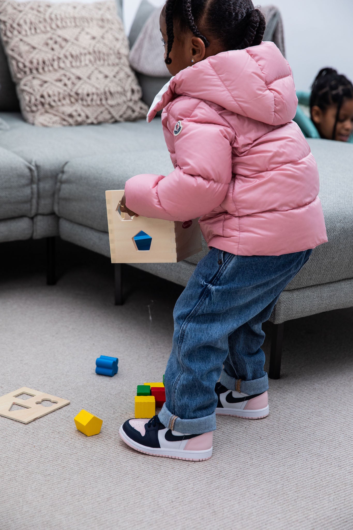 little girl wearing Air Jordan 1 High Kids 'Atmosphere' on foot