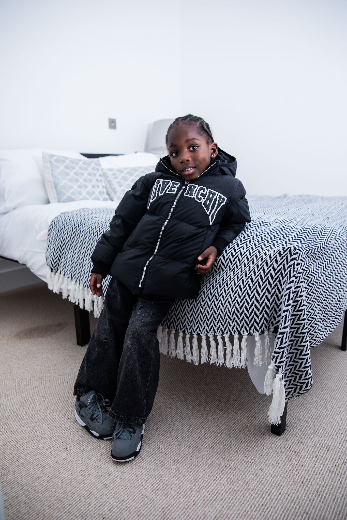 kid wearing Air Jordan 4 Kids 'Cool Grey' on foot