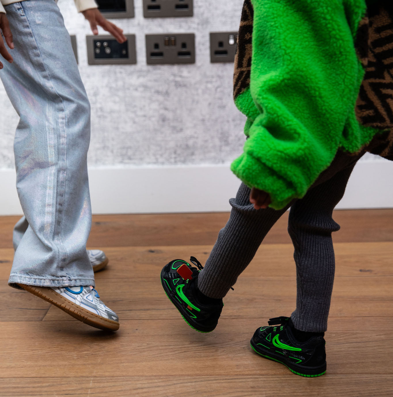 little girl wearing nike rubber dunk low off white green strike on foot