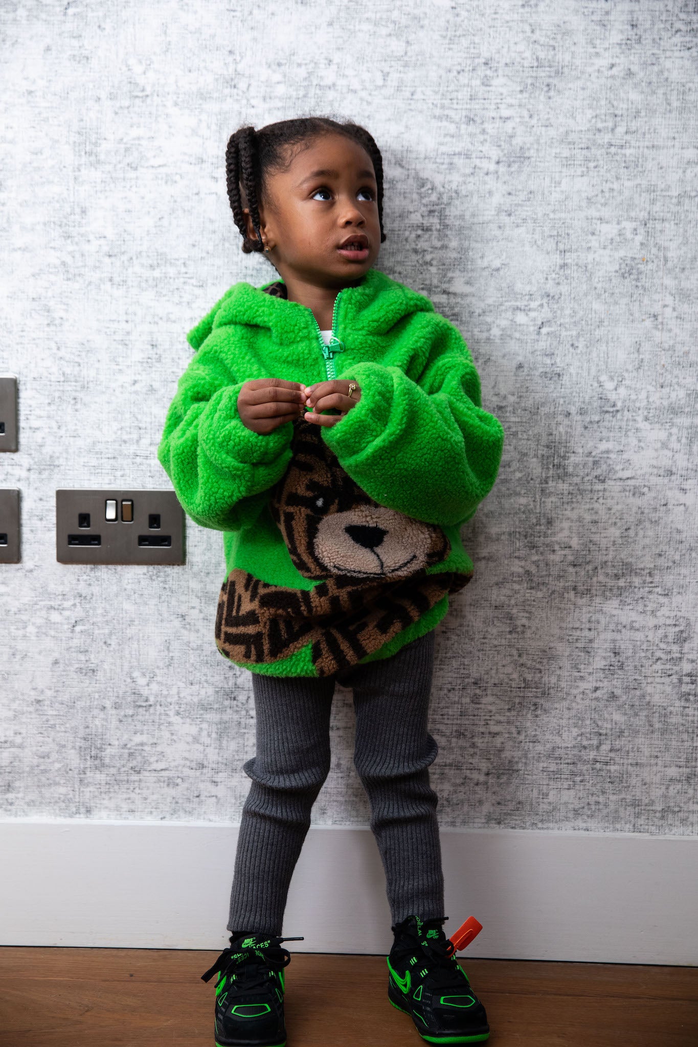 little girl wearing nike rubber dunk low off white green strike on foot