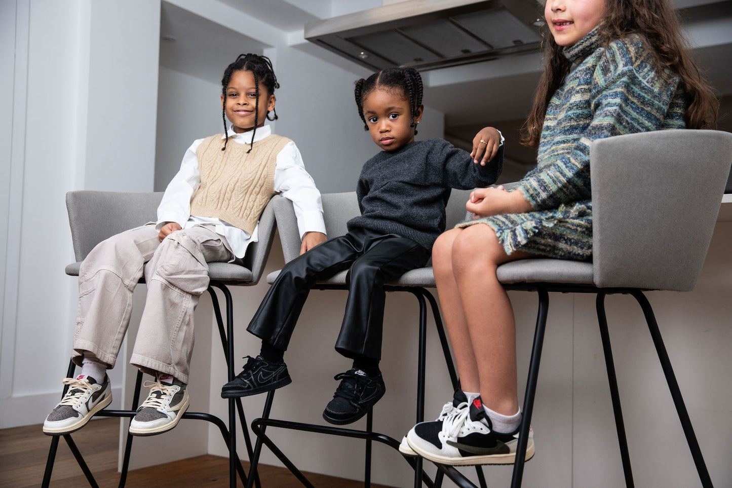 kids wearing air jordan 1 low travis scott olive on foot