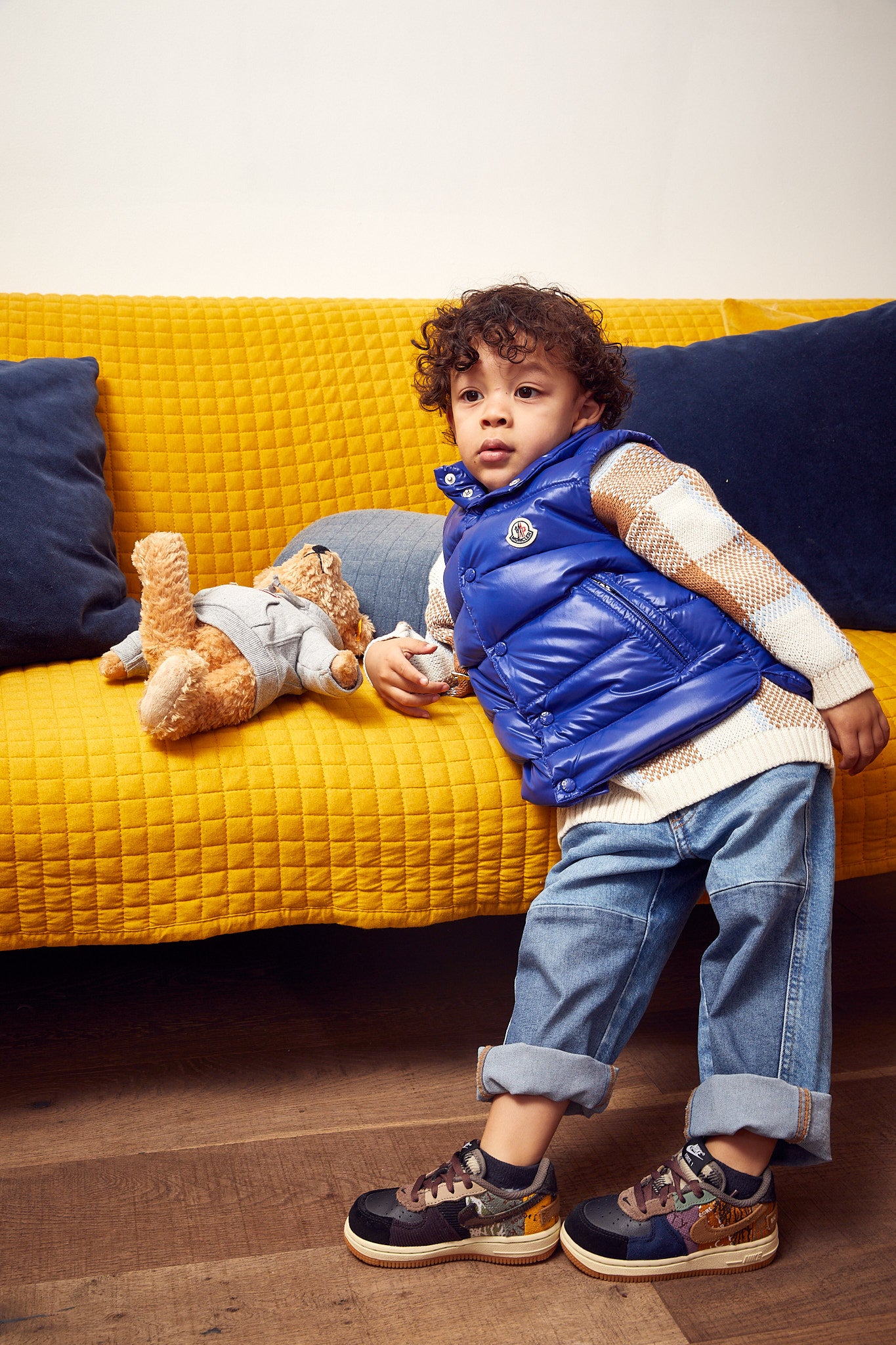 little boy wearing Nike Air Force 1 Low x Travis Scott Kids 'Cactus Jack'