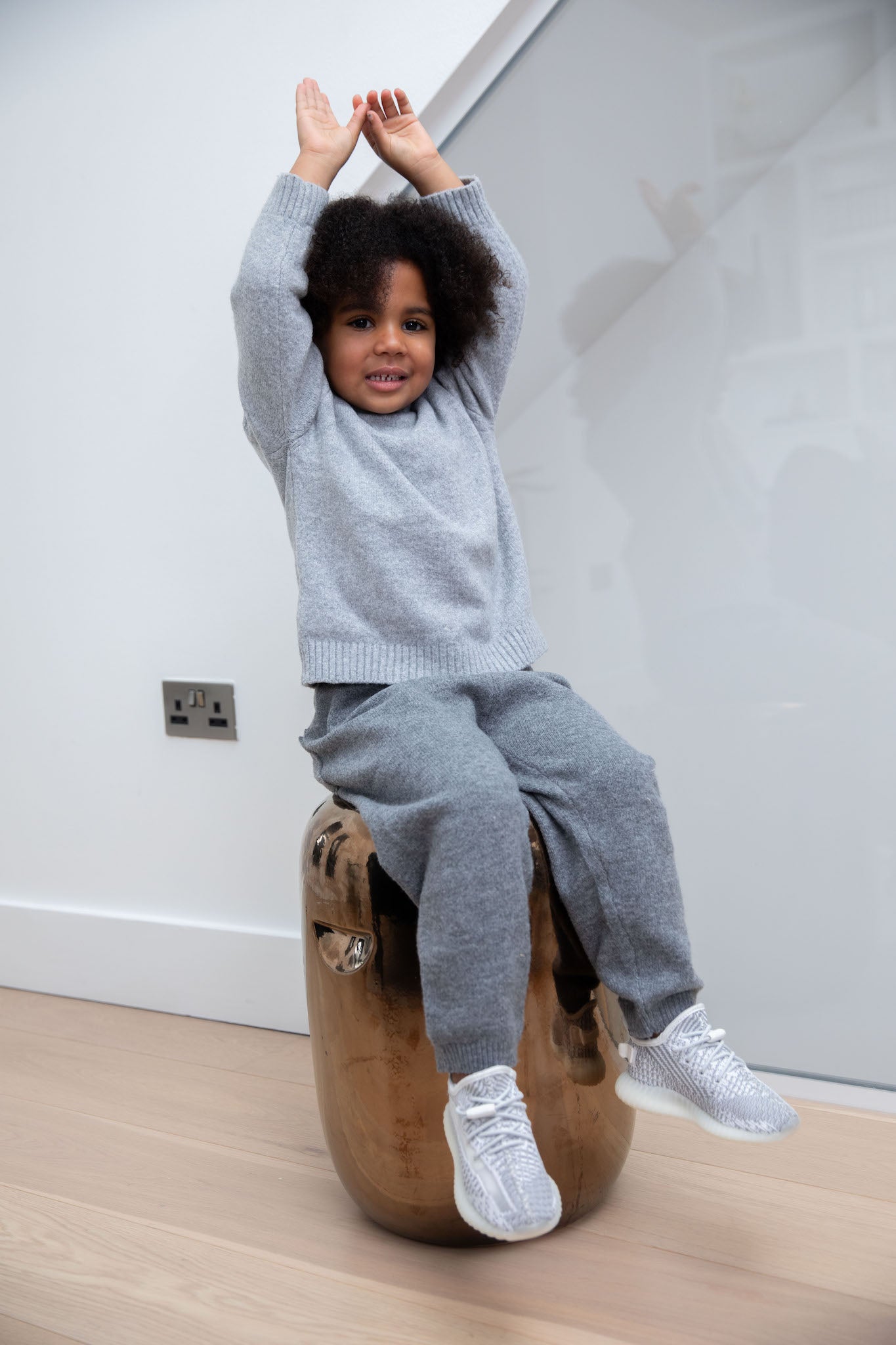 little girl wearing Adidas Yeezy Boost 350 V2 Kids 'Static' on foot