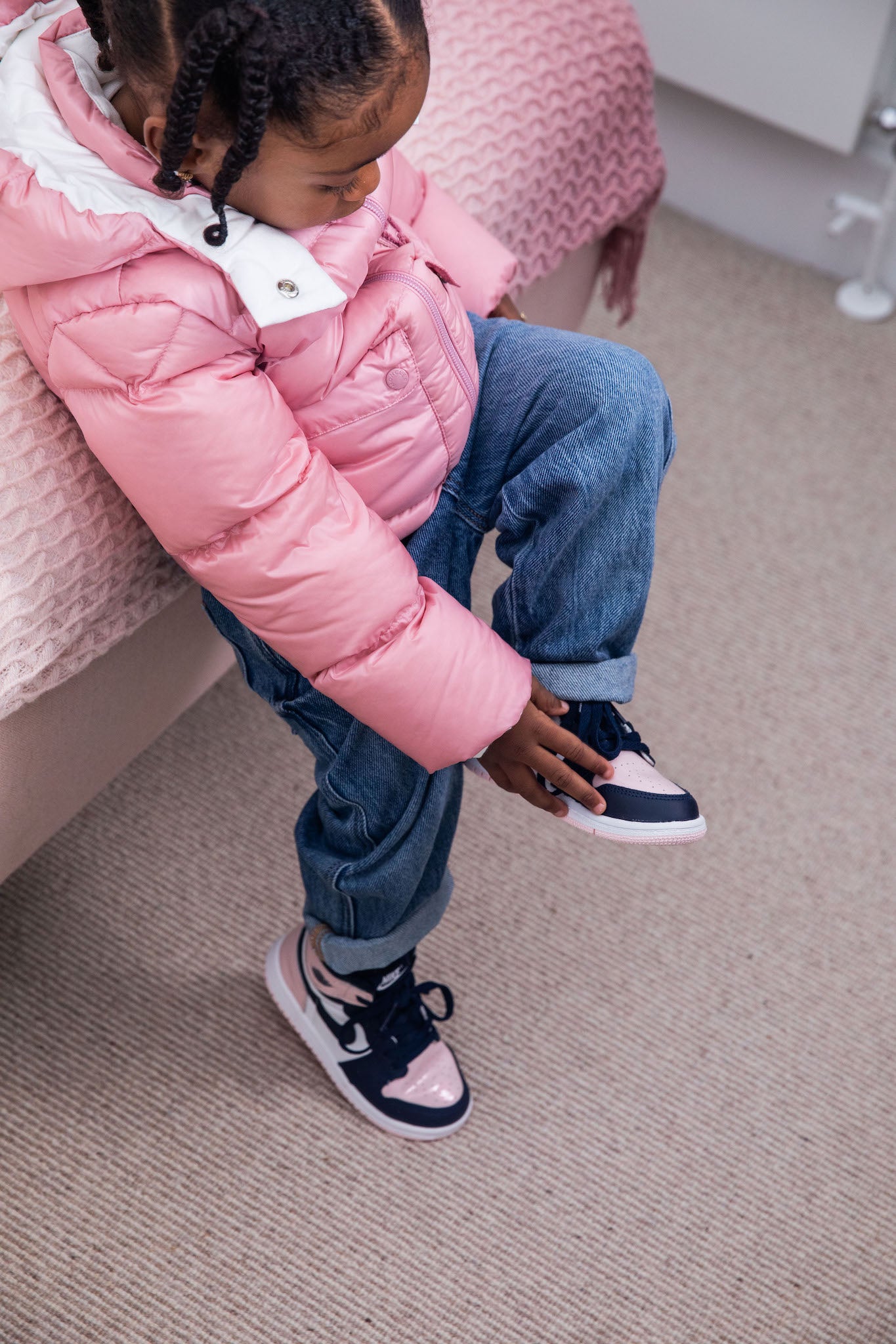 little girl wearing Air Jordan 1 High Kids 'Atmosphere' on foot