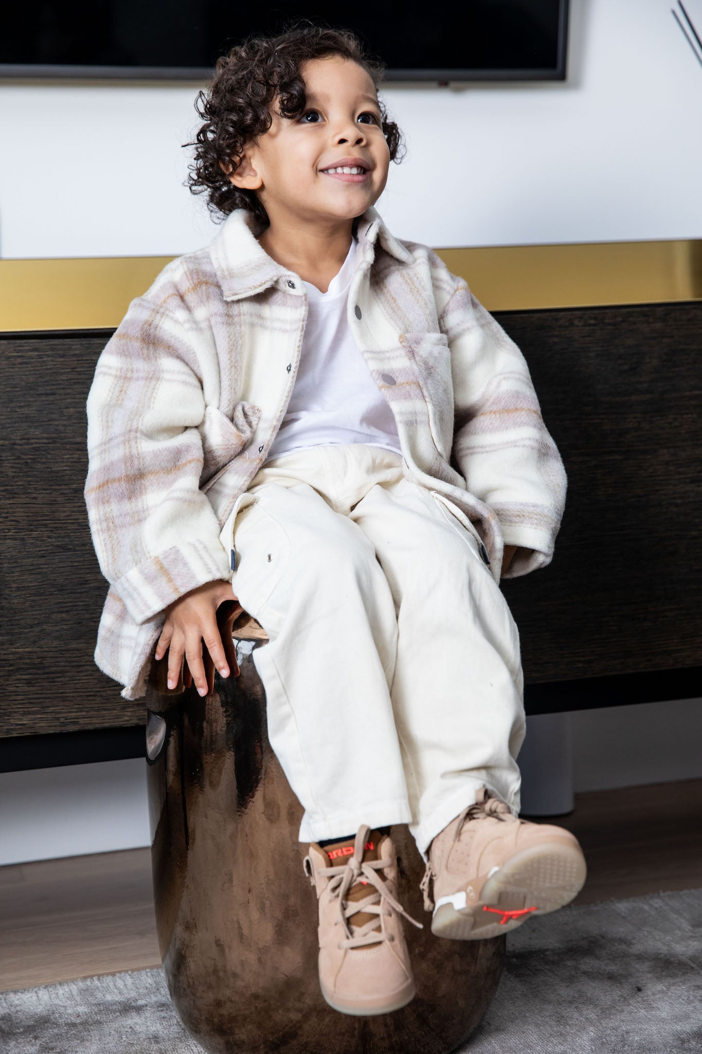 boy wearing kids air jordan 6 travis scott british khaki on foot